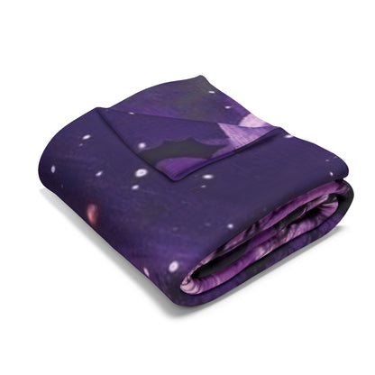 Luxurious Decorative and Warm Halloween Spooky Arctic fleece blanket in a rich purple hue, elegantly folded to showcase its plush texture.