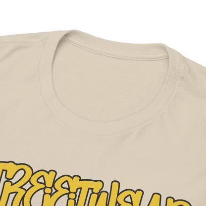 Close-up view of the neckline and intricate design details of a luxurious beige t-shirt, featuring striking yellow text and unique artwork.