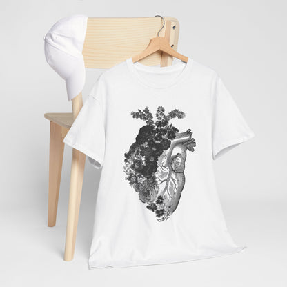 Upscale floral heart graphic t-shirt elegantly draped over a chair, highlighting the artistic blend of anatomy and nature within its design.