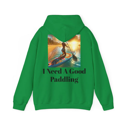 Back view of the Fantasy Paddleboarding Unisex Hooded Sweatshirt in green, featuring the text 'I Need A Good Paddling' alongside a stunning paddleboarding graphic.