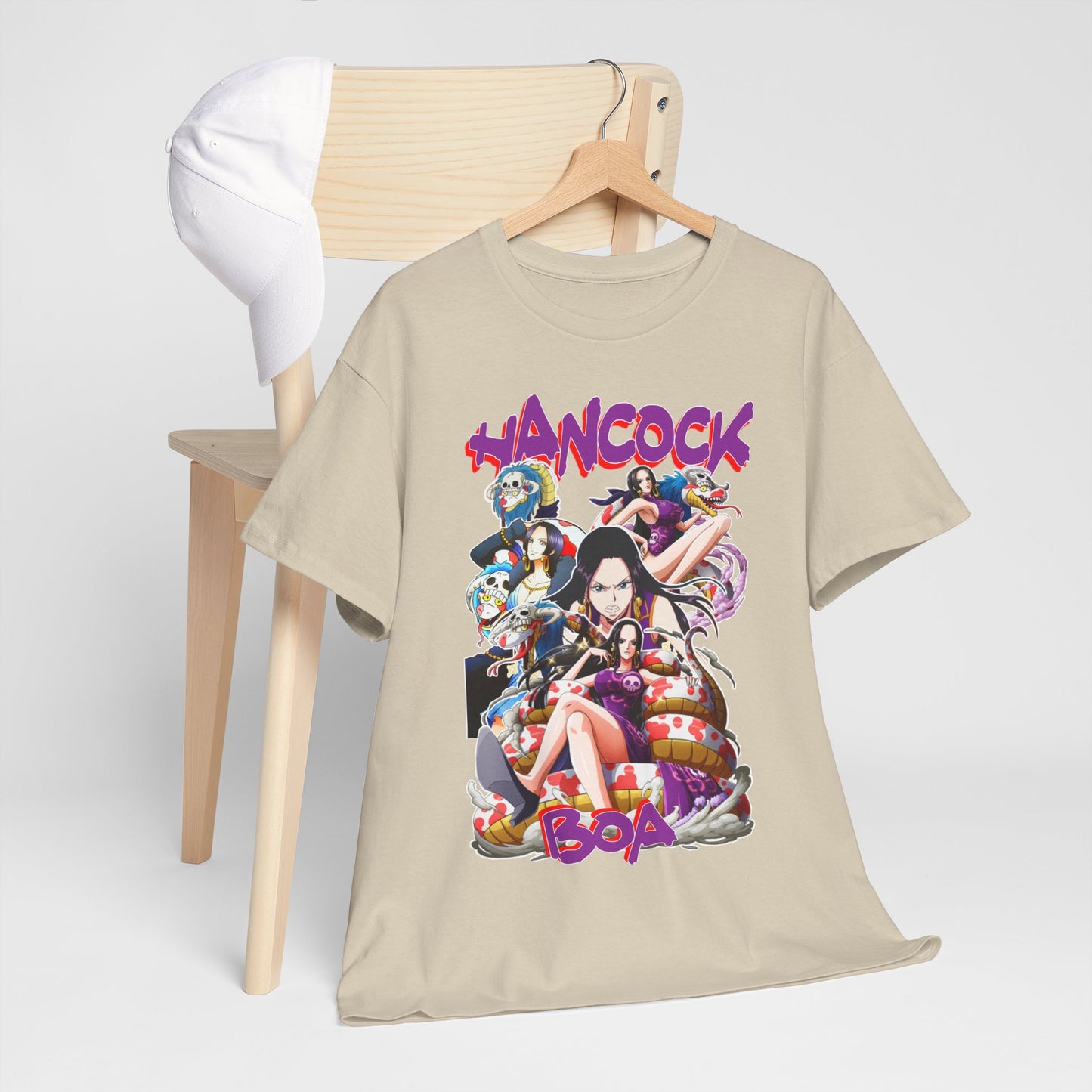 Stylish Boa Hancock T-Shirt draped over a minimalist chair, complemented by a fashionable cap, showcasing a vibrant anime-inspired graphic.