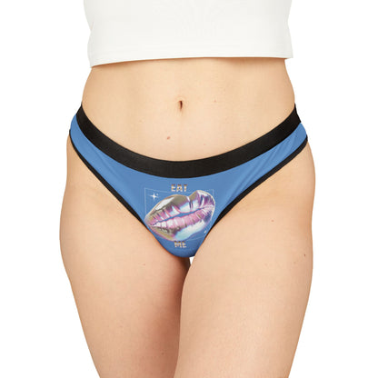 Luxurious glossy thong in blue featuring striking 3D lips graphic with 'EAT ME' text, perfect for adding a cheeky touch to your intimate apparel collection.