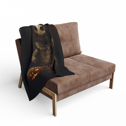 Decorative and Warm Halloween Spooky Arctic Fleece Blanket draped artistically over a plush sofa, featuring a haunting design perfect for seasonal decor.