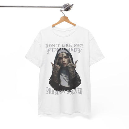 Elegant white t-shirt displayed on a hanger, featuring an eye-catching illustration of a tattooed nun with the message 'Don't Like Me? FUCK OFF' and 'PROBLEM SOLVED', combining art and attitude.
