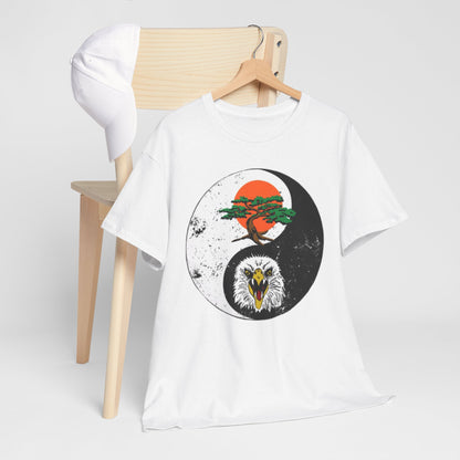 Chic t-shirt styled on a minimalist wooden chair, adorned with a captivating yin-yang graphic of a majestic bald eagle and a bonsai tree, representing martial arts philosophy.