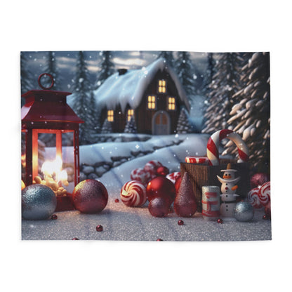 Artistic view of a winter wonderland featuring the Decorative and Warm Christmas Arctic Fleece Blanket, surrounded by festive items like candy canes and snowmen.