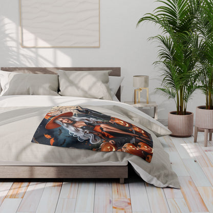 Luxurious Decorative and Warm Halloween Spooky Arctic Fleece Blanket displayed elegantly on a bed, featuring a witch with flowing hair and jack-o'-lanterns.