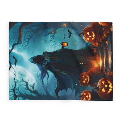 Artistic portrayal of a cloaked figure amidst glowing pumpkins and bats, set in a hauntingly beautiful landscape, ideal for a cosy Halloween vibe—Decorative and Warm Halloween Spooky Arctic Fleece Blanket 3 Sizes.