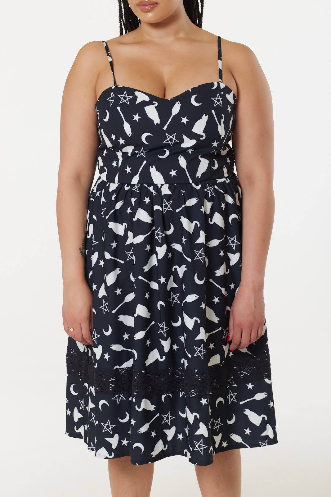 Stylish close-up of Witch Print Dress with adjustable straps and intricate lace detailing, perfect for a sophisticated and spooky wardrobe.