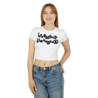 Stylish model wearing a white cropped baby T-shirt that showcases the bold 'International Pornstar' graphic, blending comfort with high fashion.