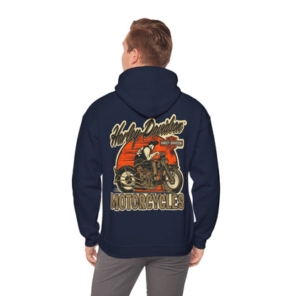 Man in a navy hoodie adorned with a vintage Harley-Davidson back print, capturing the essence of classic motorcycling with a touch of rugged elegance.