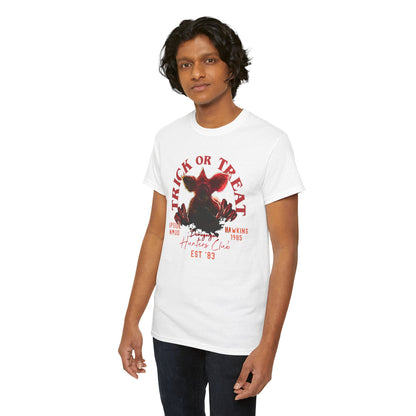 Stylish unisex t-shirt on a model, featuring a unique Demogorgon graphic and 'TRICK OR TREAT' statement, embodying a fusion of horror aesthetics and urban fashion.
