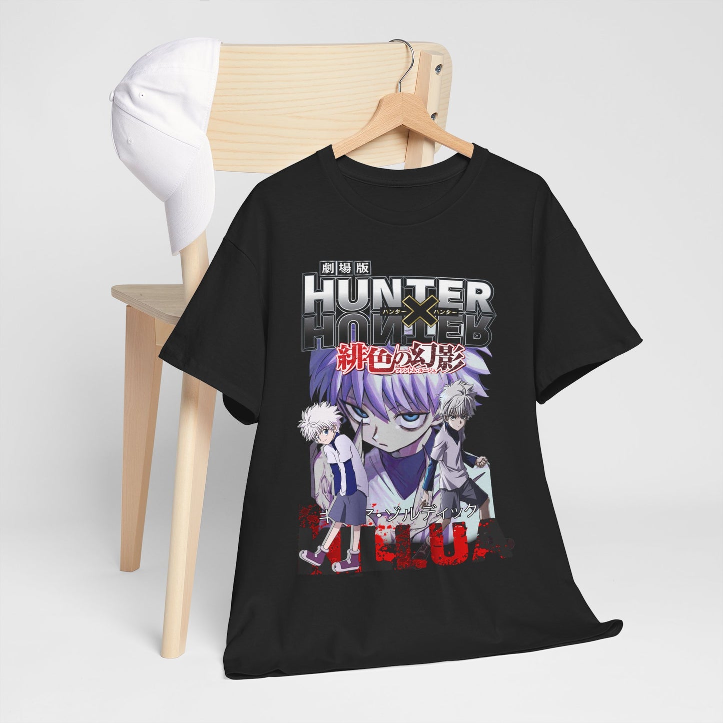 Chic 'Hunter x Hunter' t-shirt artfully placed on a wooden chair alongside a hat, highlighting its unique anime design, a statement piece for passionate collectors.