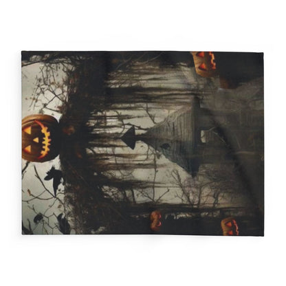 Decorative and Warm Halloween Spooky Arctic Fleece Blanket featuring a chilling Halloween scene complete with carved pumpkins and a haunted house, designed to bring seasonal elegance to your home.