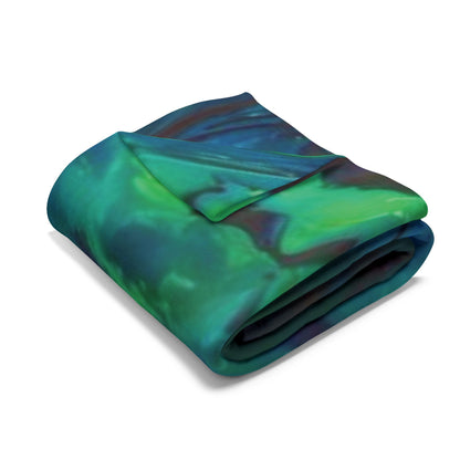 Tasteful Decorative and Warm Halloween Spooky Arctic Fleece Blanket draped over a chair, featuring striking colours and Halloween motifs, ideal for festive decoration.