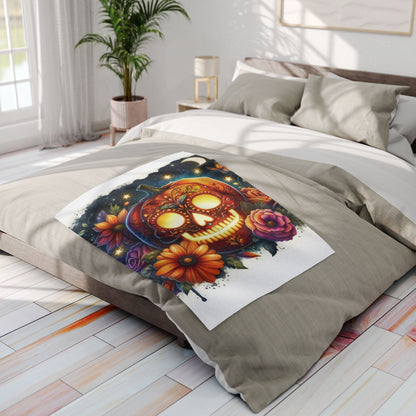 Chic Decorative and Warm Halloween Skellington Spooky Arctic Fleece Blanket elegantly displayed on a bed, adorned with a bold pumpkin skull design amidst colourful blooms, adding charm to seasonal decor.