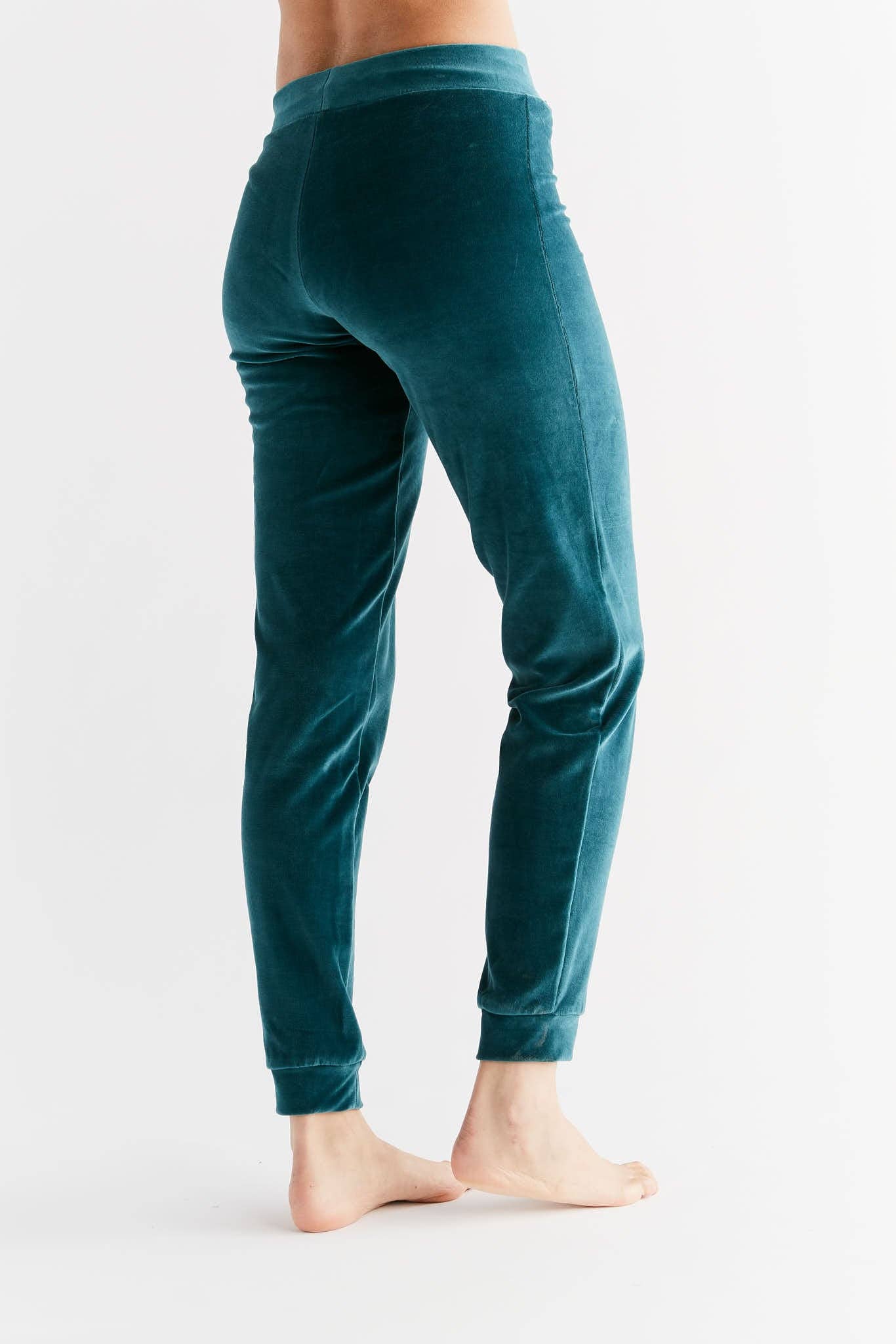Luxury women's organic cotton soft fleece sweatpants in tapered leg design with cuffed ankles and stylish zip mini pocket.