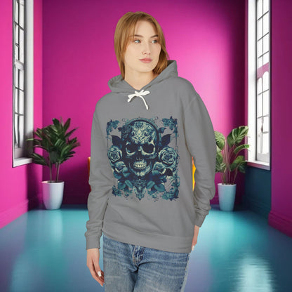 Model wearing the Skull and Roses Lightweight Hoodie in grey, displaying the striking skull and roses graphic against a vibrant pink backdrop, embodying edgy sophistication.