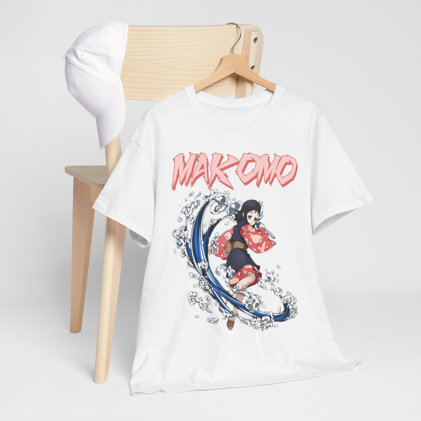 Luxurious Makomo Anime T-shirt featuring dynamic water splash art, elegantly displayed on a minimalistic wooden chair with a stylish cap.