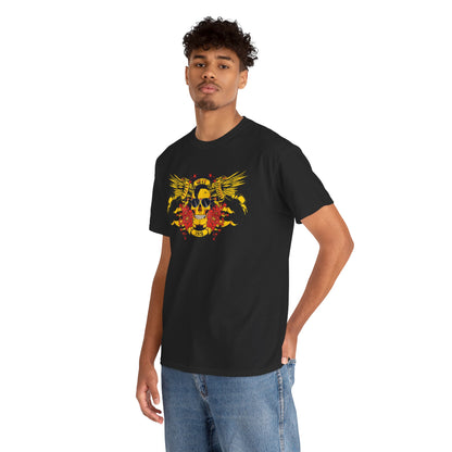 Model wearing a stylish black t-shirt with striking yellow skull and wing artwork, embodying bold fashion and luxury aesthetics in casual wear.