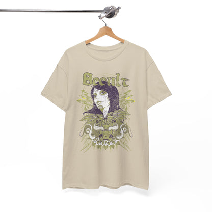 Artfully displayed beige graphic t-shirt on a wooden hanger, showcasing a captivating design that includes a portrait with Day of the Dead motifs and the word 'Occult', exuding an enchanting vibe.