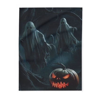 Luxurious Decorative and Warm Halloween Spooky Arctic Fleece Blanket featuring ghostly figures and a carved jack-o'-lantern, perfect for cozying up this Halloween season.