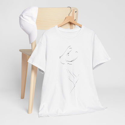 Stylish white t-shirt with a unique animal design, beautifully arranged alongside a classic cap on a wooden chair, for a trendy, relaxed aesthetic.