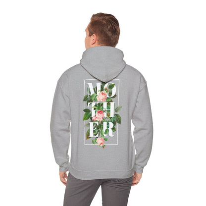 Man wearing a sophisticated grey hoodie with an intricate floral 'MOTHER' design on the back, blending style and sentiment.