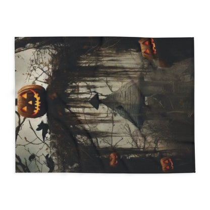 Elegant Decorative and Warm Halloween Spooky Arctic Fleece Blanket featuring a haunting pumpkin and atmospheric scenery, perfect for seasonal decor.