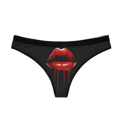 Elegant women's thong in black showcasing a bold design of glistening red lips and dripping detail, ideal for adding a cheeky touch to special moments.