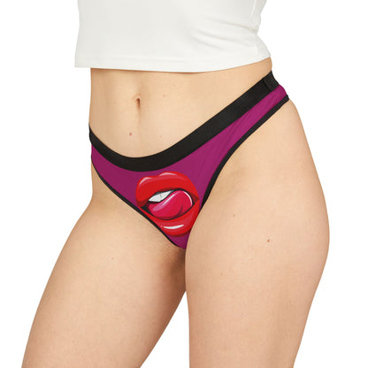 Luxurious women's thong featuring a playful design with vibrant red lips and a cheeky tongue illustration, perfect for adding a touch of humour and flirtation to your intimate apparel collection.
