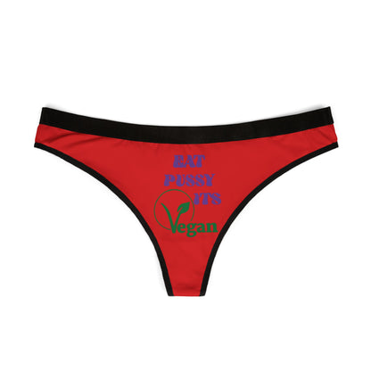 Chic red thong showcasing 'Eat Pussy, It's Vegan' design, highlighted by bold purple and green text, perfect for those who value comfort and humour in luxury lingerie.