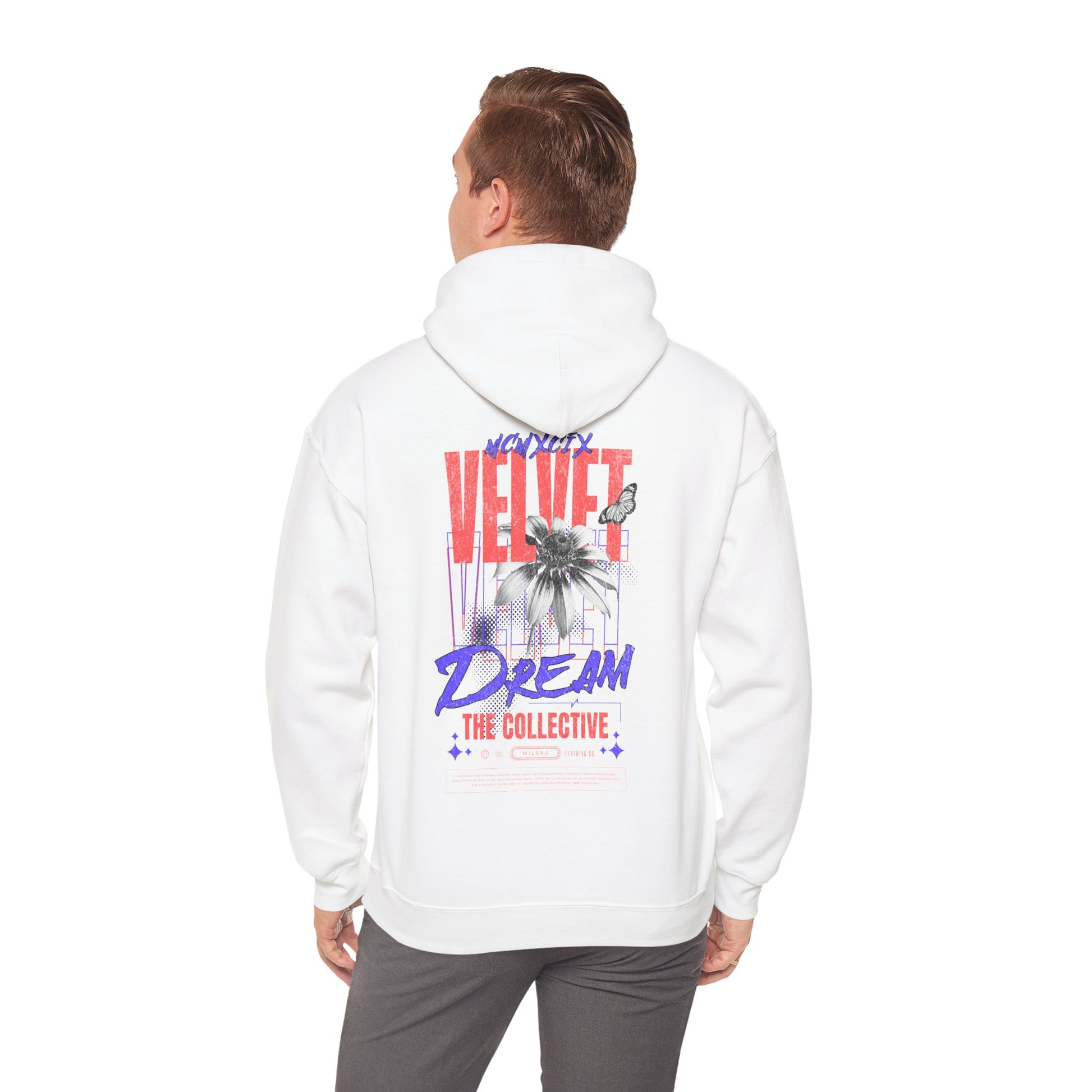 Stylish individual wearing a white hoodie with bold VELVET DREAM design, highlighting high fashion and street style.