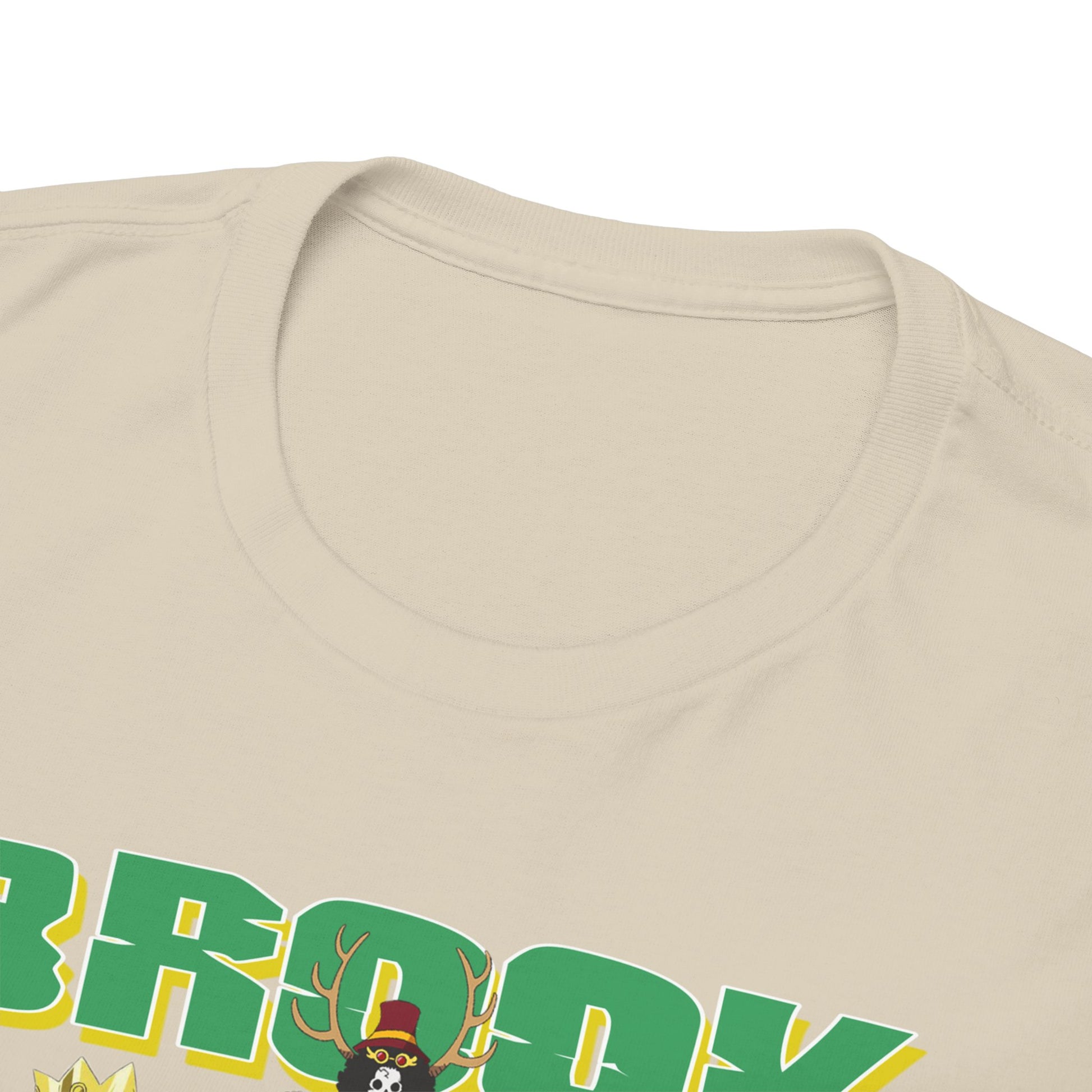 Close-up detail of the Brook & Crew Men's T-Shirt neckline and bold graphic print, showcasing its premium quality and design excellence in a soft beige hue.