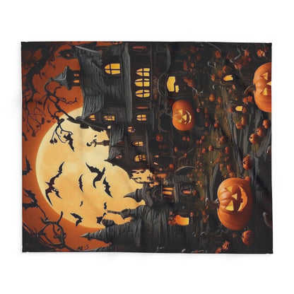 Richly designed Decorative and Warm Halloween Spooky Arctic Fleece Blanket laid flat, highlighting its stunning print of a haunted landscape with glowing pumpkins for Halloween charm.