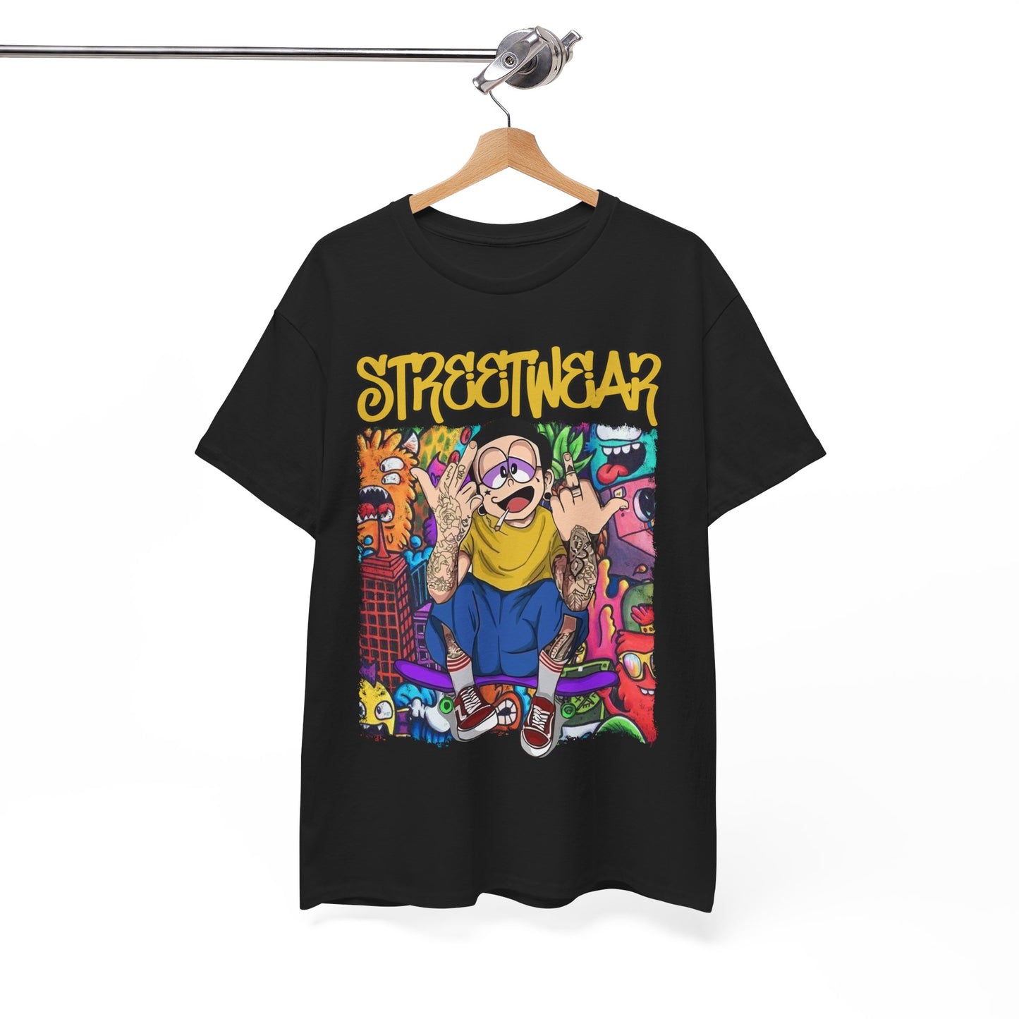 Chic black t-shirt displayed on a wooden hanger, showcasing a playful cartoon character and striking graffiti designs, embodying contemporary street fashion.