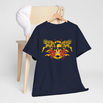 Chic presentation of a navy blue t-shirt with a bold yellow skull and wings graphic, complemented by red flowers, displayed alongside a stylish white cap.