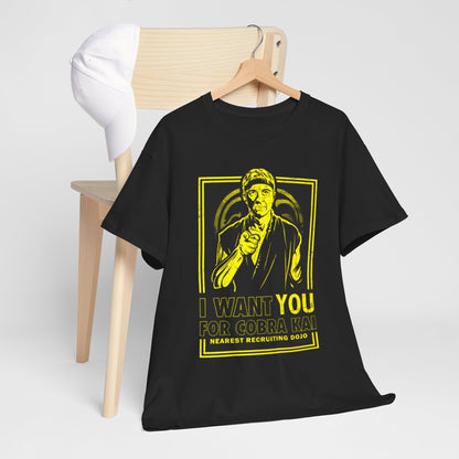 Elegant Cobra Kai t-shirt showcased on a wooden chair beside a stylish hat, adorned with the text 'I Want You for Cobra Kai', perfect for casual outings with a touch of flair.