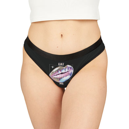 Luxurious 'Eat Me' cheeky thong featuring a glossy metallic print of luscious, holographic lips, designed for a bold and daring look.