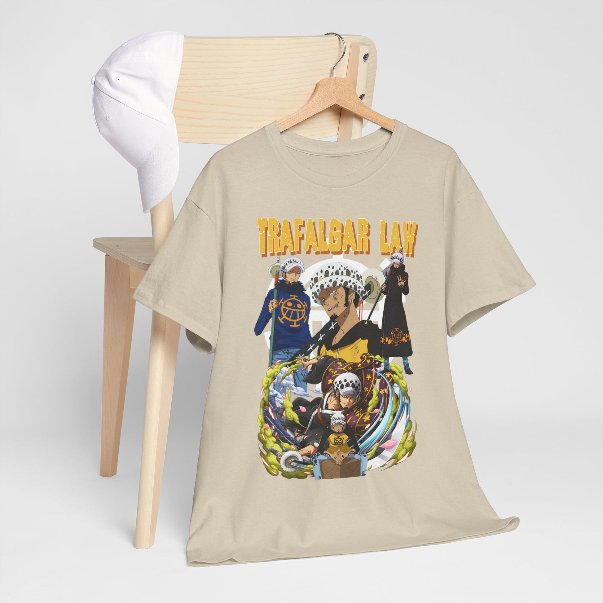 Chic Trafalgar Law Men's T-Shirt draped over a chair, paired with a cap, reflecting modern urban styling for anime fans.