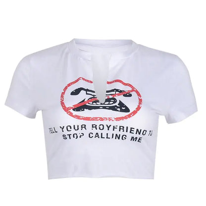 Elegant white graphic crop top from Dazzling Dreams Studio featuring the playful slogan 'Tell Your Boyfriend to Stop Calling Me', perfect for contemporary fashion lovers.