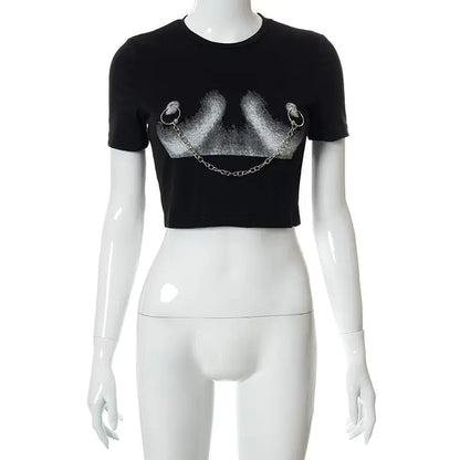 Dazzling Dreams Studio Daring Chain Cropped Women's Tee featuring abstract graphics and chic metallic chain detail on a stylish model in an urban setting.