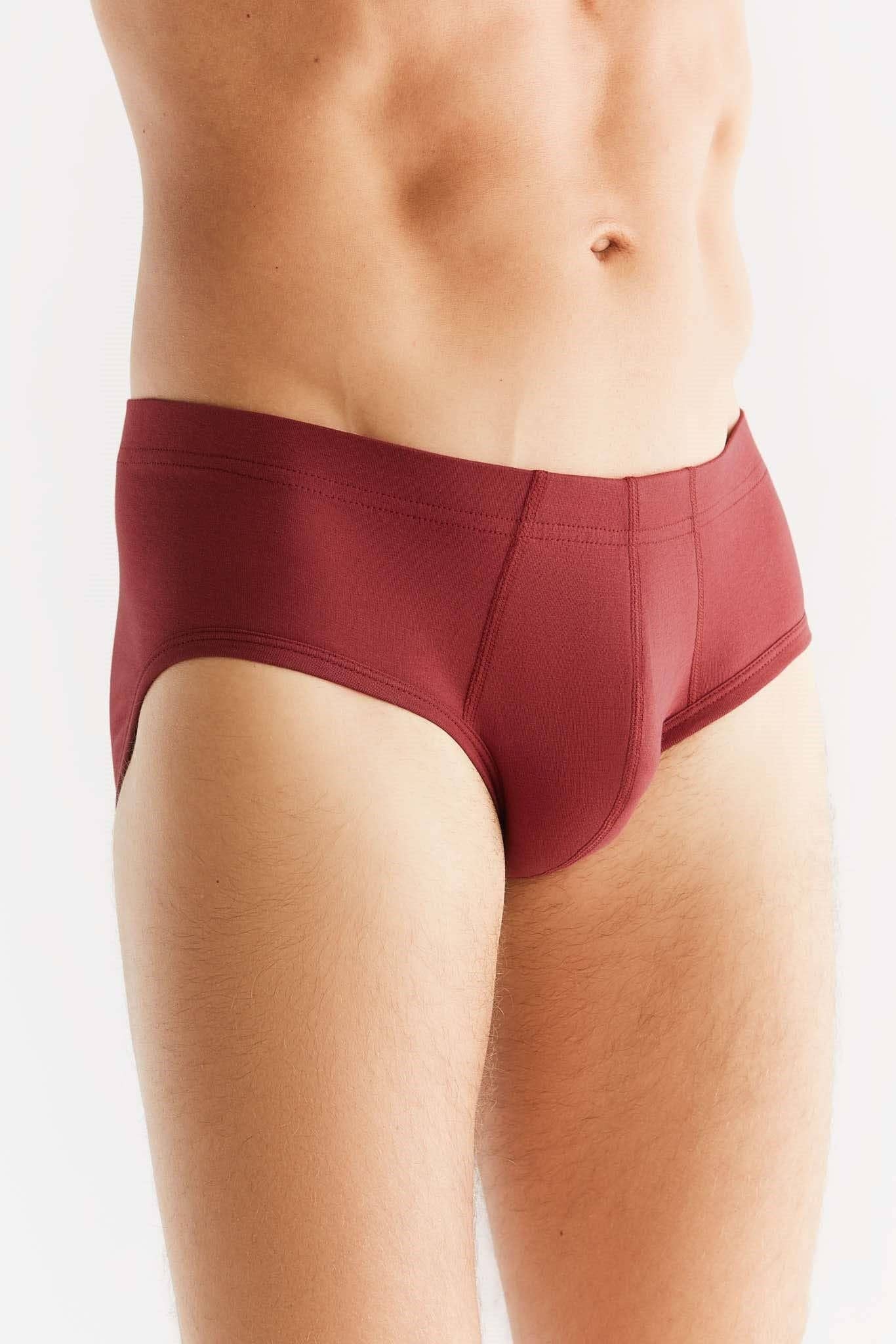 Lifestyle image of a man wearing luxury organic cotton briefs, demonstrating superior comfort and modern fit.