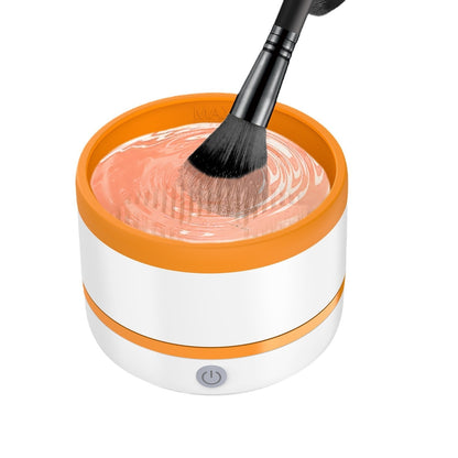Dazzling Dreams Studio Makeup Brush Automatic Cleaning Device in elegant design with a makeup brush being dipped into cleansing solution, showcasing its luxurious cleaning capabilities.