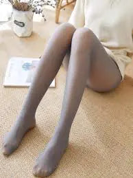 Elegant display of Luxurious Women's Fleece Lined Tights in a subtle grey tone, highlighting refined comfort and style perfect for layering.