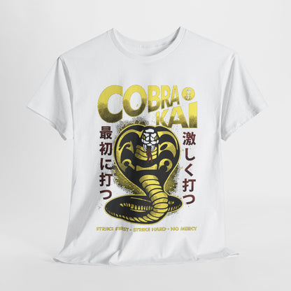 Luxurious white graphic t-shirt featuring a striking Cobra Kai design, showcasing a stylised black and gold snake, with bold Japanese text translating to 'Strike First, Strike Hard, No Mercy', embodying the spirit of martial arts elegance and prowess.