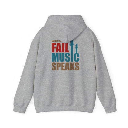 Elegant grey hoodie showcasing a bold typography design on the back, featuring the phrase 'WHEN WORDS FAIL MUSIC SPEAKS'.