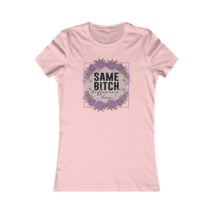 Chic pink women's t-shirt showcasing a delicate floral design framed around the phrase 'Same Bitch Different Day', a perfect blend of inspiration and femininity.