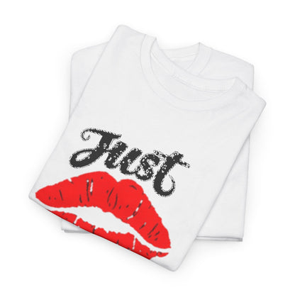 Elegant stacked graphic tees showcasing the 'Just Kiss Me!' design, featuring vibrant red lips on a clean white background, symbolising playful romance.