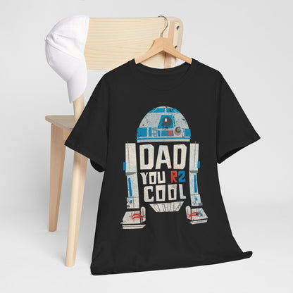 Star Wars R2D2 DAD Graphic T-Shirt displayed on a wooden chair with a stylish white cap, perfect for gifting to dads who are fans of the galaxy.